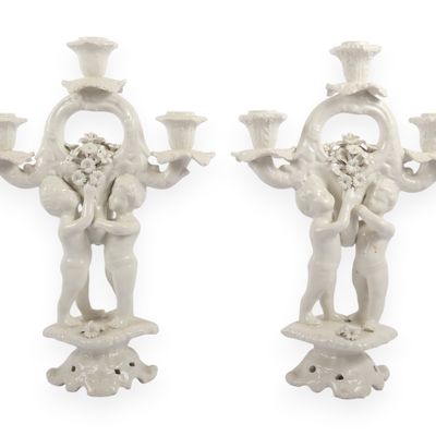 A Pair of Italian White Glazed Porcelain Three-Light Figural Candelabra