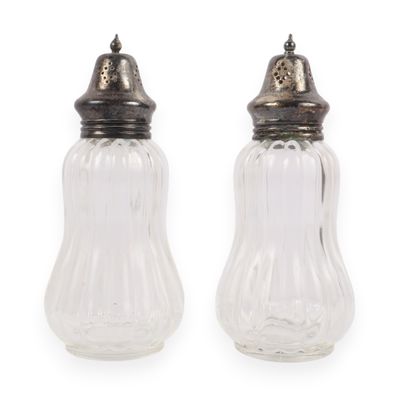 A Pair of Pressed Glass Sugar Shakers with Silver-Toned Metal Caps