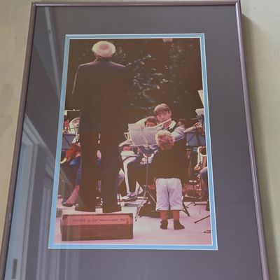 Framed Photograph of Conductor Leonard Bernstein with Child