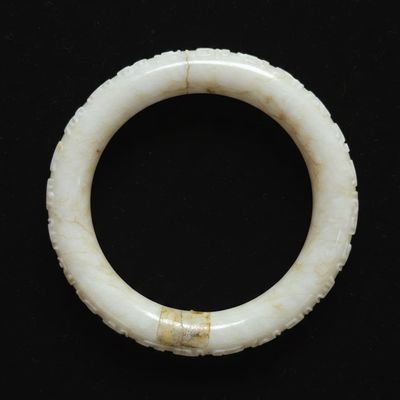 Sale Photo Thumbnail #286: Carved White Jadeite Bangle with Archaistic Motifs and Repair