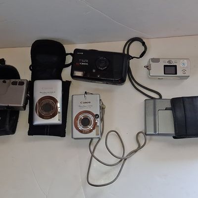 Sale Photo Thumbnail #81: Collection of Vintage Digital and Film Cameras with GPS Device