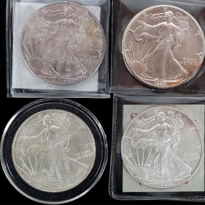 ASSORTED FINE SILVER AMERICAN EAGLES - (4)