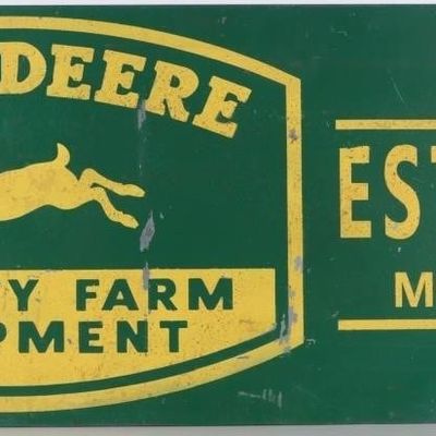 Sale Photo Thumbnail #443: VINTAGE JOHN DEERE 41.25" EMBLEM & EST. METAL SIGN
