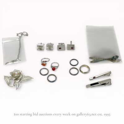 An Assortment of Silver and Silver-Toned Jewelry and Accessories