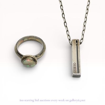 Two Pieces of Sterling Silver and Silver-Toned Jewelry Including a Guess Pendant Necklace and an Opal Inlay Ring