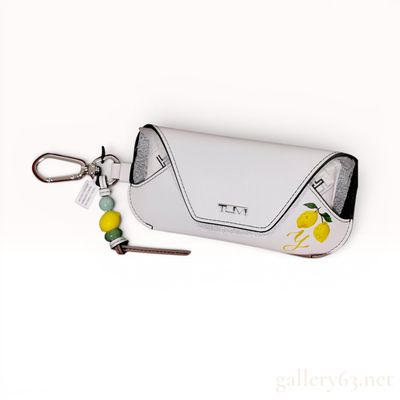 Tumi Belden White Leather Sunglass Case Charm with Lemon Motif