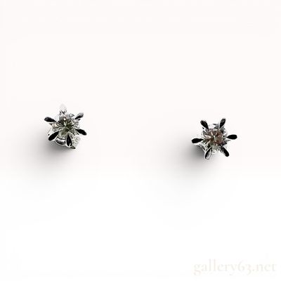 A Pair of Platinum and Diamond Solitaire Stud Earrings