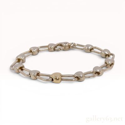 Tiffany and Co. Sterling Silver and 18 Karat Yellow Gold Heart Link Bracelet