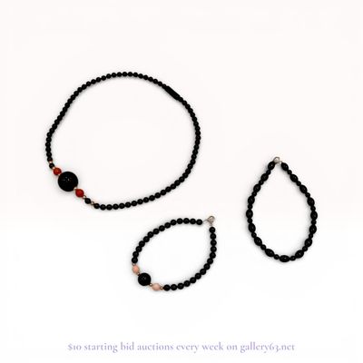 A Trio of Beaded Jewelry Including a Necklace and Two Bracelets