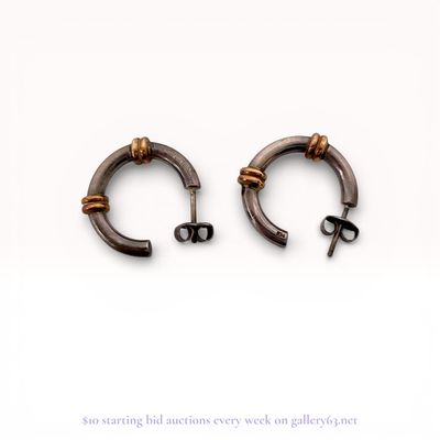 A Pair of Sterling Silver and 14 Karat Gold Two-Tone Hoop Earrings