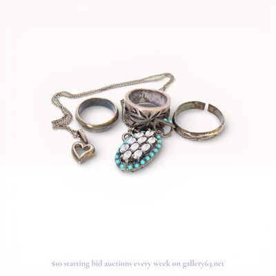 An Assortment of Five Pieces of Sterling Silver and Costume Jewelry