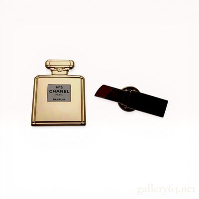 Two Chanel La Collection Gold-Toned Enamel Lapel Pins