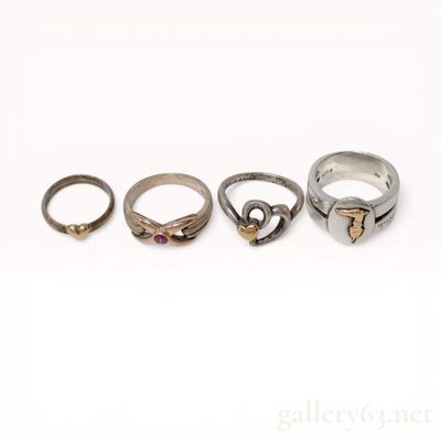 Four Mixed Karat Gold and Sterling Silver Rings