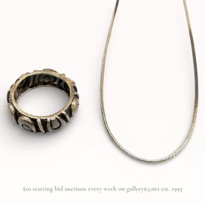 Two Sterling Silver Jewelry Items Including a Snake Chain Necklace and Artisan Band Ring