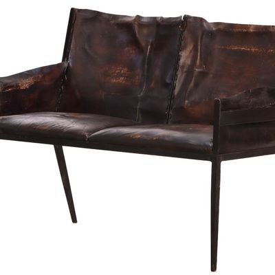 TWO SEAT IRON AND LEATHER SETTEE IN THE MANNER OF JEAN-MICHEL FRANK.