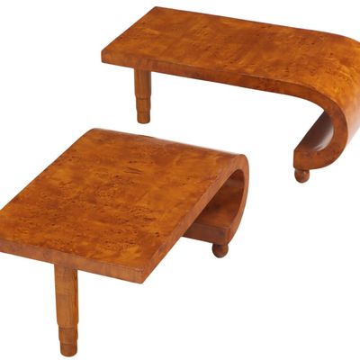 A PAIR OF BENTWOOD BURL END TABLES EACH HAVING A SINGLE LEG AND ONE CURVED END.