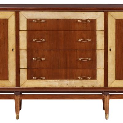 TWO DOOR MAHOGANY AND PARCHMENT SIDEBOARD WITH FOUR DRAWERS RESTING ON 8 LEGS C 1950.