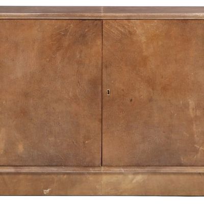 PARCHMENT COVERED FOUR DOOR SIDEBOARD HAVING A RECESSED BASE C 1950.