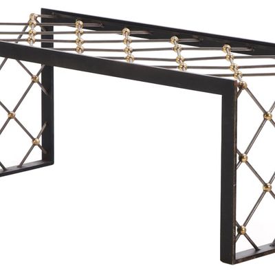 A SUBSTANTIAL BRONZE AND IRON COFFEE TABLE HAVING A GLASS TOP IN THE MANNER OF JEAN ROYERE.