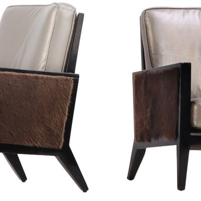 PAIR OF LACQUERED AND LEATHER LOUNGE CHAIRS WITH FUR PANELS.