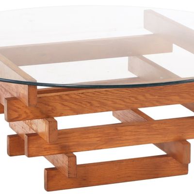 A DAVID HICKS STYLE STACKED OAK AND GLASS COFFEE TABLE.