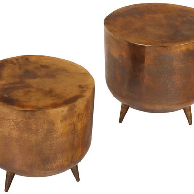 PAIR OF CAST ALUMINUM DRUM FORM END TABLES HAVING A COPPER WASH.