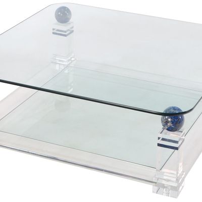 A LUCITE TWO TIERED COFFEE TABLE HAVING BLUE STONE SPHERES AND THICK GLASS TOP C 1980. DISMANTLES