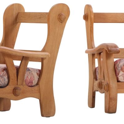 PAIR OF HEAVY OAK LOUNGE CHAIRS WITH LOOSE CUSHION UPHOLSTERY C 1965.