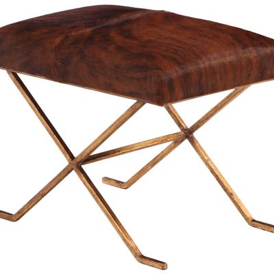 GILT IRON AND COW HIDE STOOL IN THE MANNER OF JEAN-MICHEL FRANK.