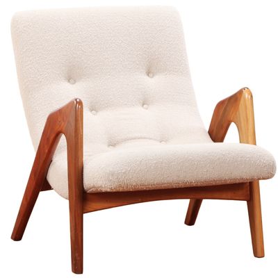 AN OPEN ARM LOUNGE CHAIR BY ADRIAN PEARSALL HAVING RECENT FABRIC.