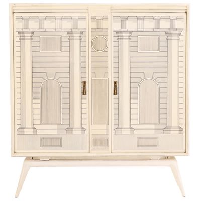 A PAINT DECORATED BAR CABINET IN THE MANNER OF FORNASETTI HAVING MIRRORED UPPER CABINET C 1960.