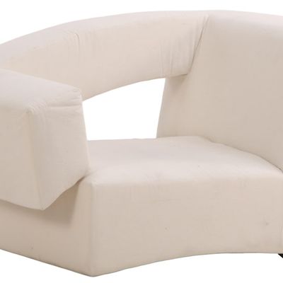 AN UPHOLSTERED ASYMMETRIC CHAIR IN THE MODERNIST TASTE.