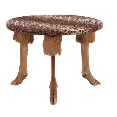 THREE PIECE TABLE AND STOOL SET COMPRISED OF DEER FEET, WOOD AND FAUX LEOPARD FABRIC.