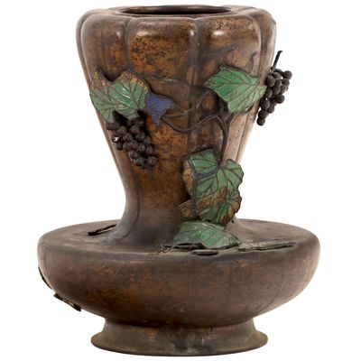 A SIGNED JAPANESE BRONZE VASE WITH GRAPES.