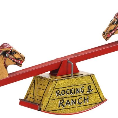 A VINTAGE ROCKING AND RANCH WIND UP TOY.