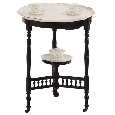 A RARE OCCASIONAL TABLE HAVING OCTAGONAL INSET PORCELAIN TOP AND TEA SET STAMPED WEDGWOOD