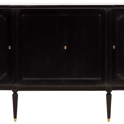 EBONIZED MAHOGANY SIDEBOARD HAVING FOUR DOORS AND A FITTED INTERIOR C 1940.