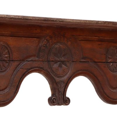 CONTINENTAL CARVED OAK WALL SHELF WITH PINWHEEL CARVINGS.