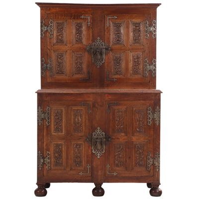 TWO PART OAK CABINET HAVING ELABORATE STEEL HARDWARE AND CARVED PANELS INSIDE AND OUT. MOST