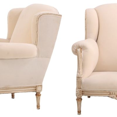 PAIR OF LOUIS XVI STYLE PAINTED AND GILTWOOD WINGED BERGERE CHAIRS C 1940. RECENTLY RESTORED.