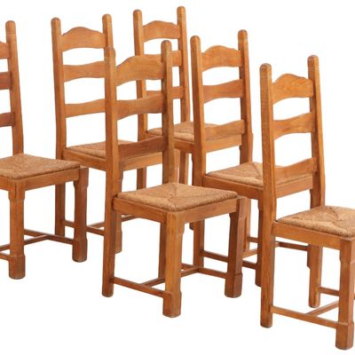 SIX FRENCH OAK AND RUSH SEAT DINING CHAIRS.