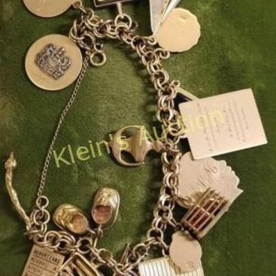 1960's 14K gold charm bracelet 64 grams!