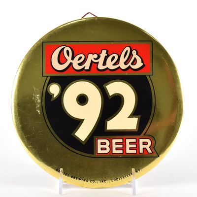 Sale Photo Thumbnail #567: Oertels 92 Beer 1950s Tin-Over-Cardboard Button Sign