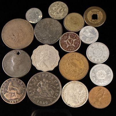 A Collection of Mixed World Coins and Tokens including CA, DE, ES, HK, PT, CU, MX, JP, and CN