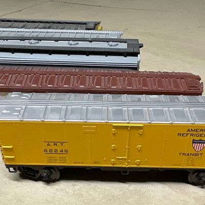 Sale Photo Thumbnail #119: A Collection of Five Lionel and Other O-Gauge Model Railroad Freight Cars