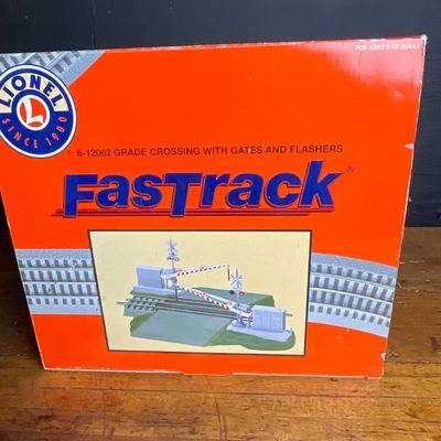 Sale Photo Thumbnail #145: Lionel FasTrack 6-12062 O-Gauge Grade Crossing with Gates and Flashers in Original Box