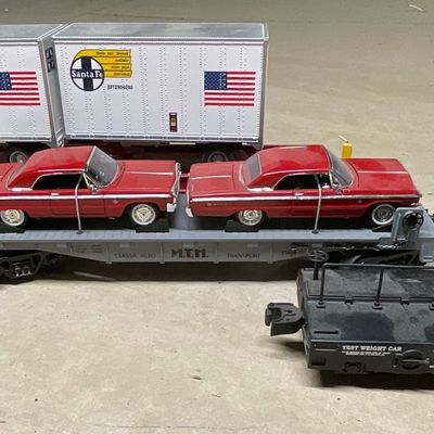 Sale Photo Thumbnail #114: A Collection of M.T.H. RailKing O-Gauge Flatcars and a Test Weight Car