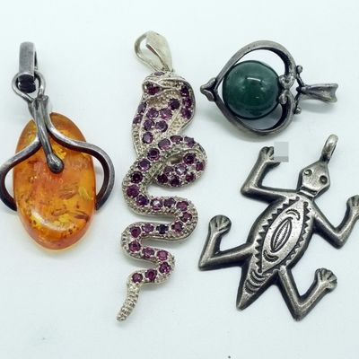 Four Sterling Pendants
