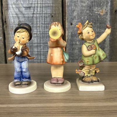Sale Photo Thumbnail #27: A Trio of Goebel Hummel Porcelain Figurines including Serenade, Little Gabriel, and Spring Cheer