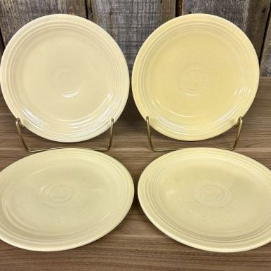 Sale Photo Thumbnail #348: A Set of Four Homer Laughlin Fiesta Yellow Bread and Butter Plates